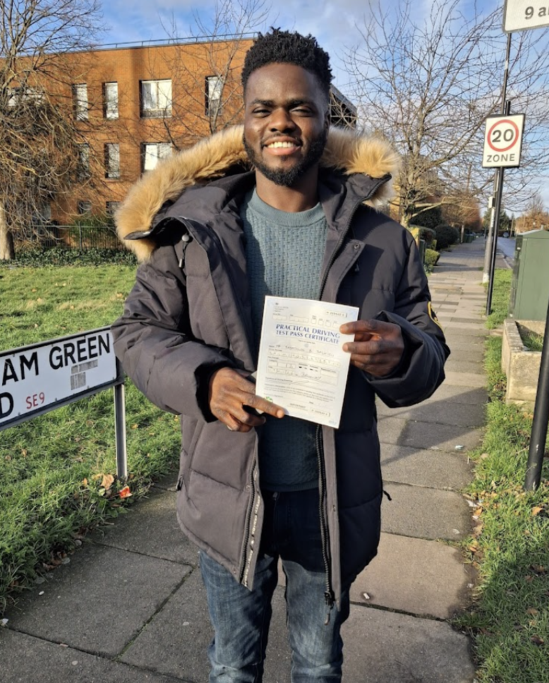Student with pass certificate on Eltham Green Rd