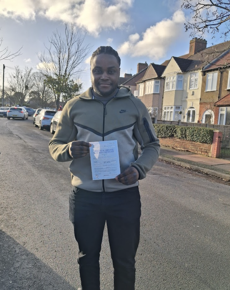 Student in olive tech hoodie with pass certificate