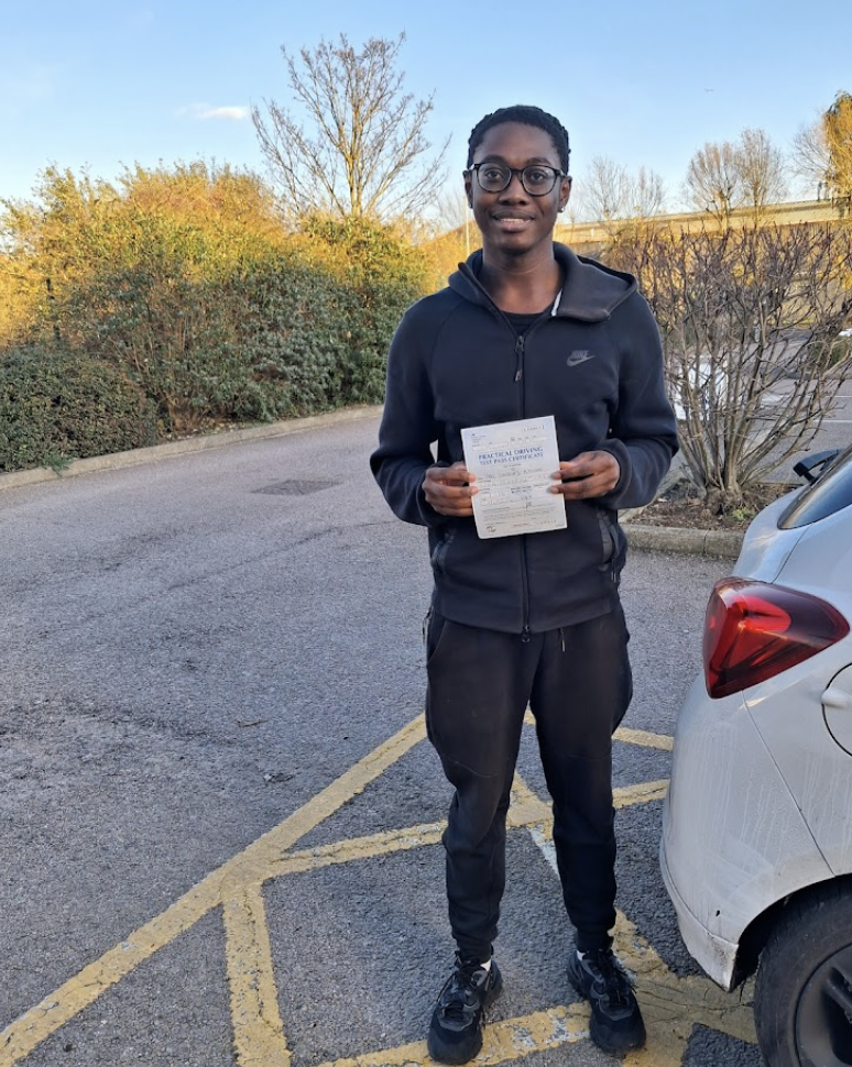 Student with pass certificate, car park